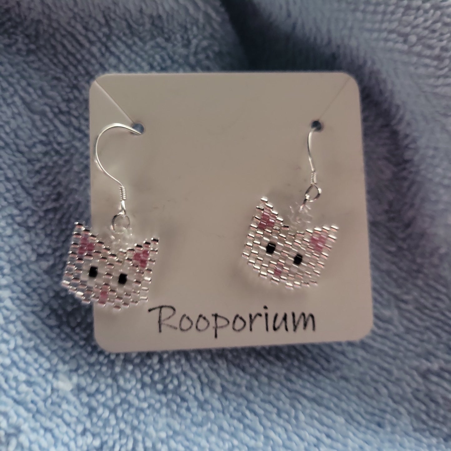 White cat earrings