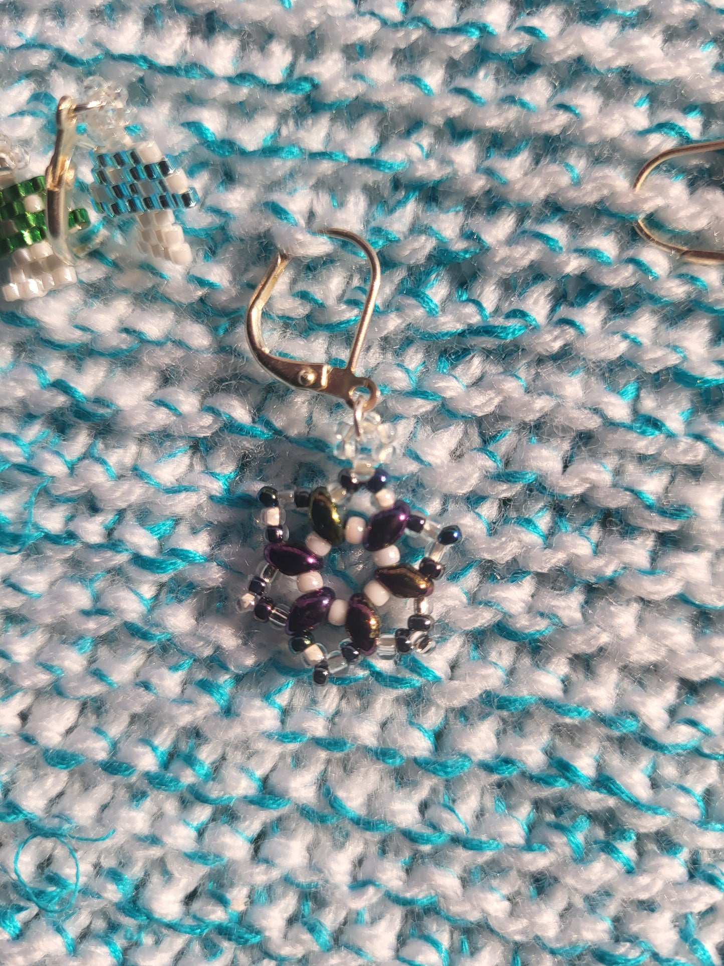 Twin bead purple and white snowflake stitch marker